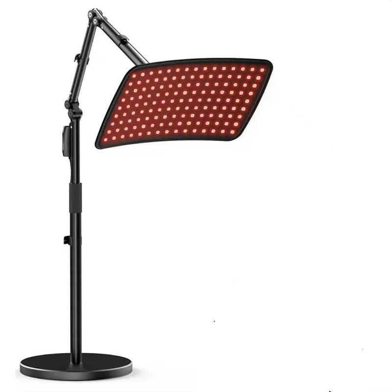 Person using a red light therapy device on a white background